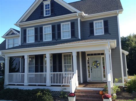 grey house exterior paint with metal roof wood beams|gray exterior paint.